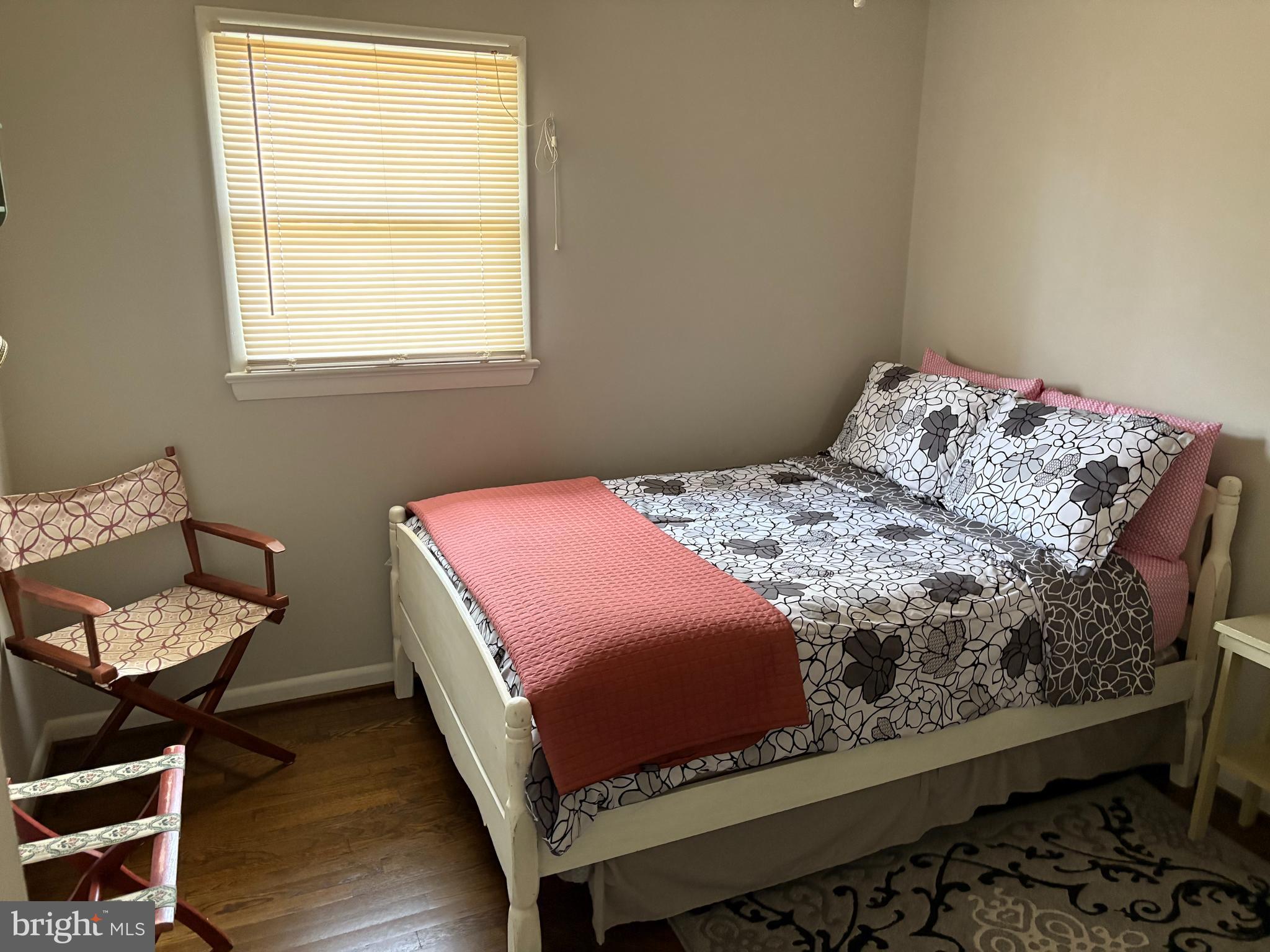 2605 Harrington Road Chester, MD 21619 - Photo 17 of 27 a bedroom with a bed and chair