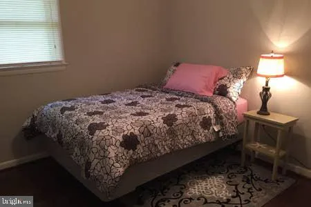 a bathroom with a sink shower and a mirror