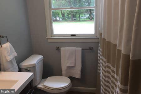 2605 Harrington Road Chester, MD 21619 - Photo 20 of 29 a white toilet sitting next to a window