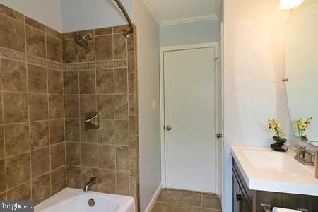 2605 Harrington Road Chester, MD 21619 - Photo 21 of 29 a bathroom with a sink shower and a mirror