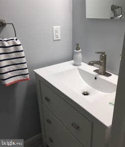 2605 Harrington Road Chester, MD 21619 - Photo 23 of 29 a bathroom with a sink and a mirror