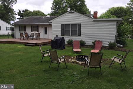 2605 Harrington Road Chester, MD 21619 - Photo 25 of 29 a front view of house with a garden and patio