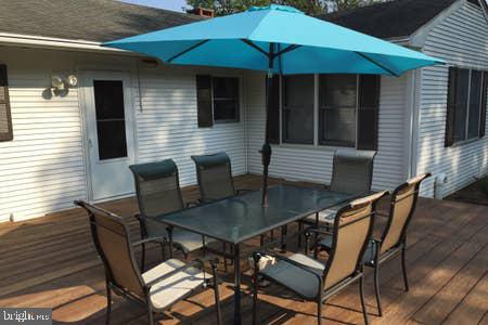 2605 Harrington Road Chester, MD 21619 - Photo 26 of 29 a patio with table and chairs