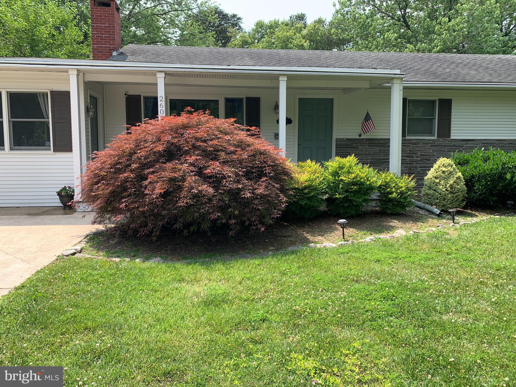 2605 Harrington Road Chester, MD 21619 - Photo 28 of 29 a view of a house with garden and plants