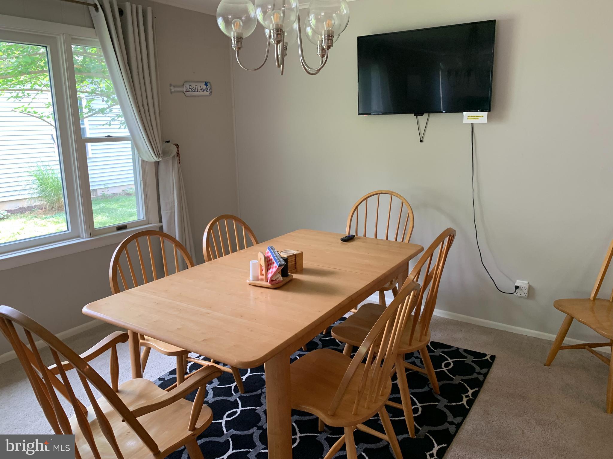 2605 Harrington Road Chester, MD 21619 - Photo 6 of 27 a view of a dining room with furniture and window