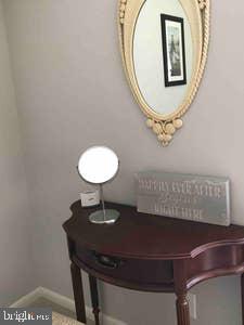 2605 Harrington Road Chester, MD 21619 - Photo 10 of 29 a view of a hallway with a table and a mirror