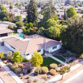 an aerial view of a houses with yard