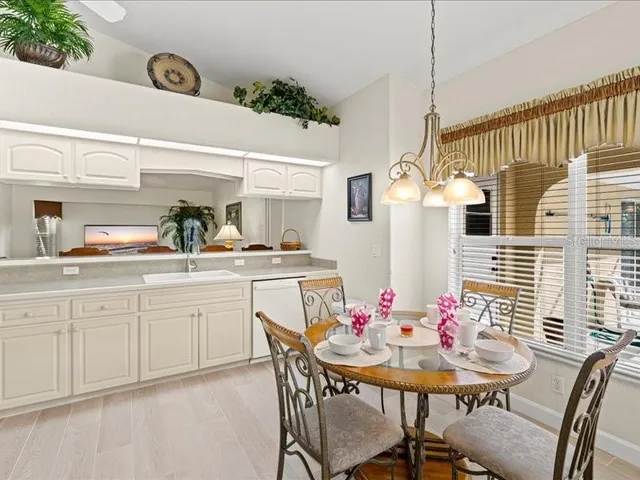 a living room with furniture potted plant and a window