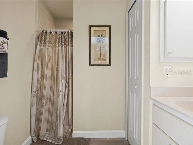 a view of a patio with a table chairs and a backyard