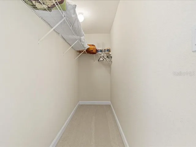 a view of a patio with a table and chairs