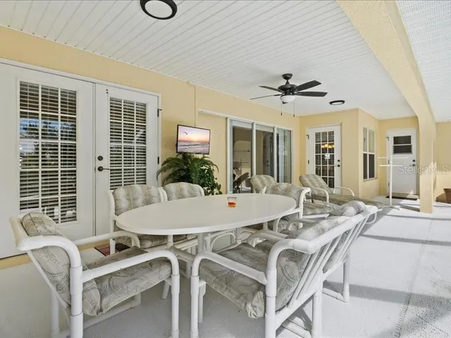 a view of a lake with a house in the background