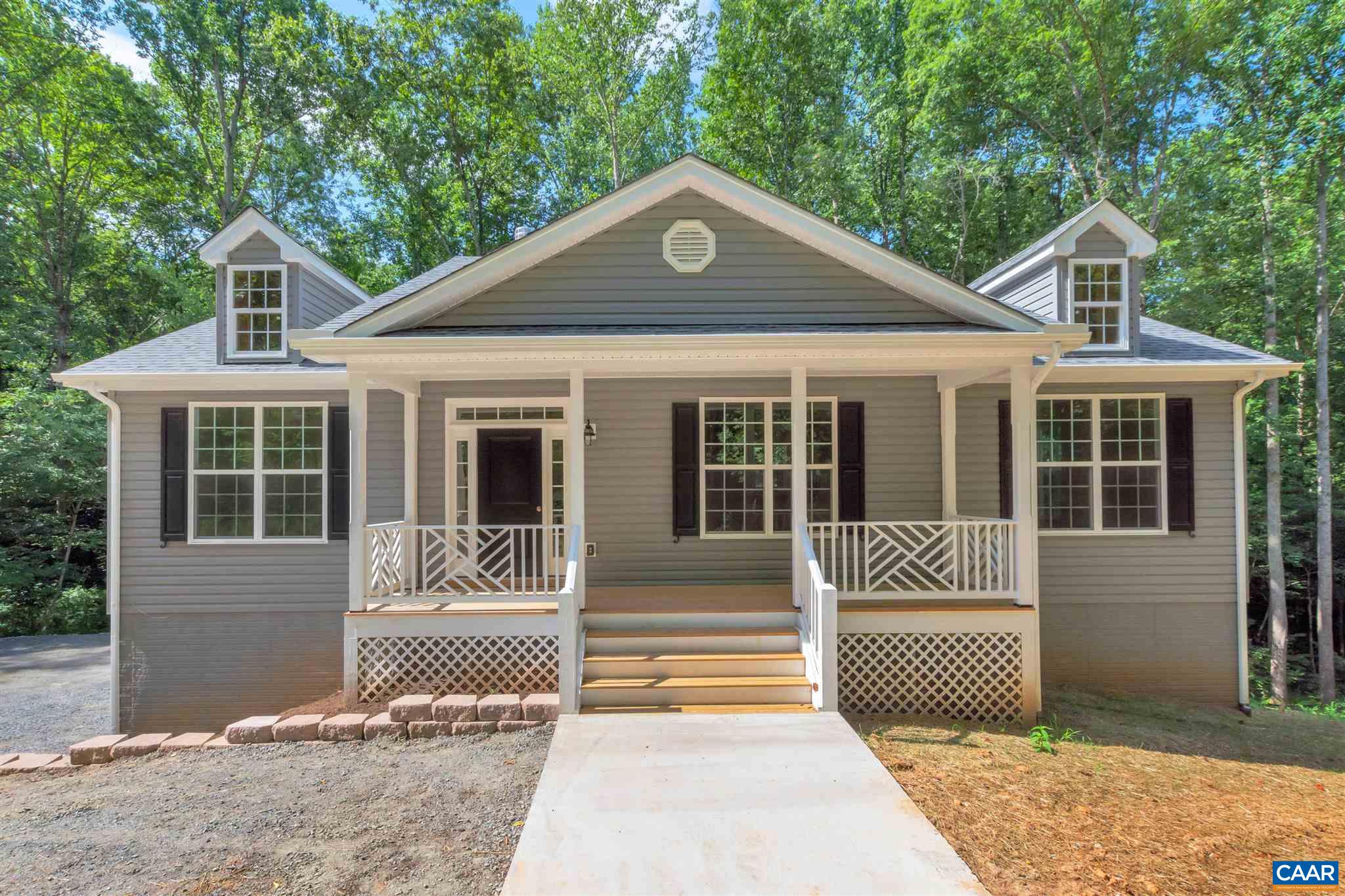 312 Jonquil Road Ruckersville, VA 22968 - Photo 1 of 34 a front view of a house with a yard