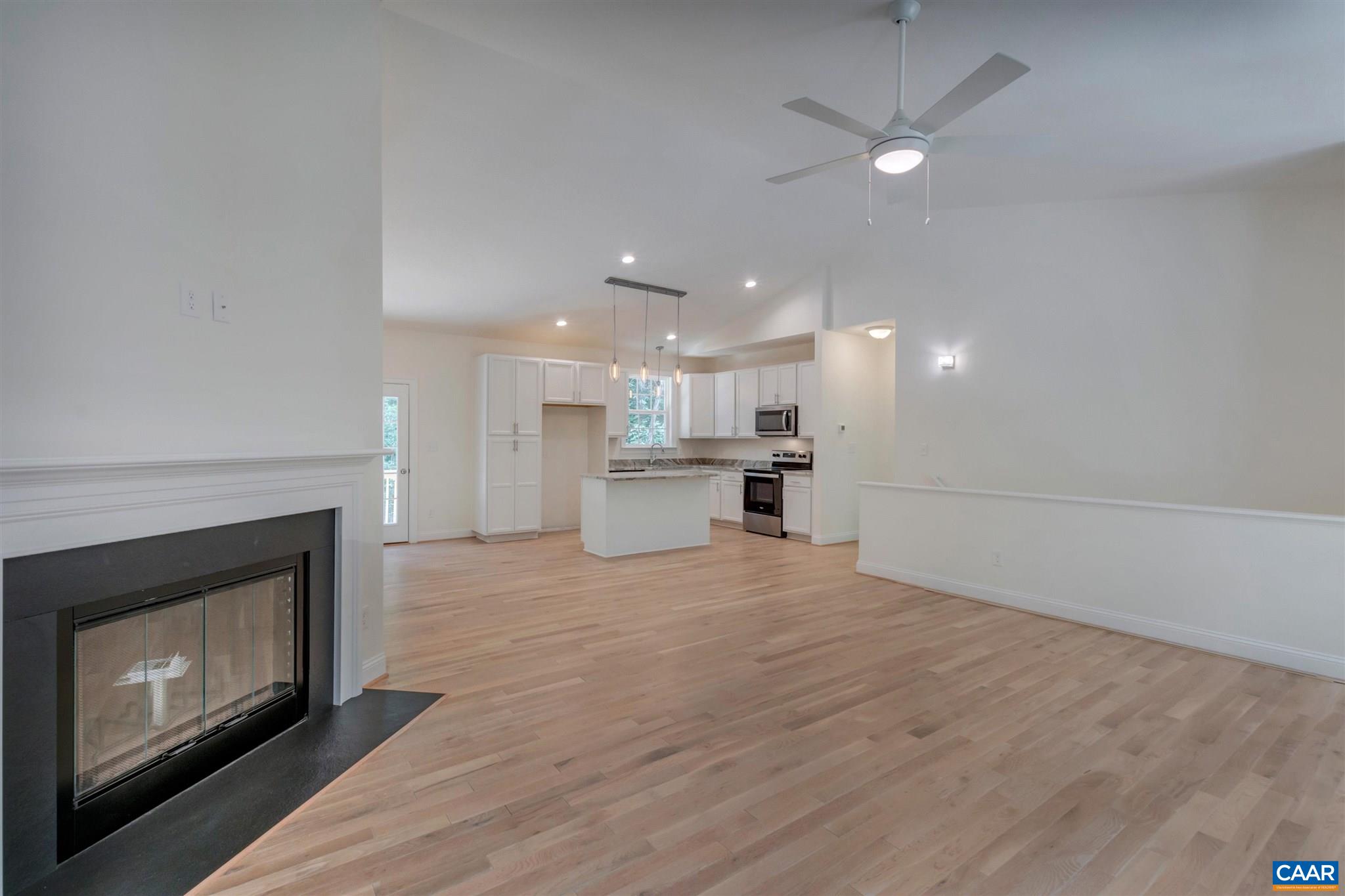312 Jonquil Road Ruckersville, VA 22968 - Photo 2 of 34 a view of a kitchen with a stove kitchen counter top space and a fireplace