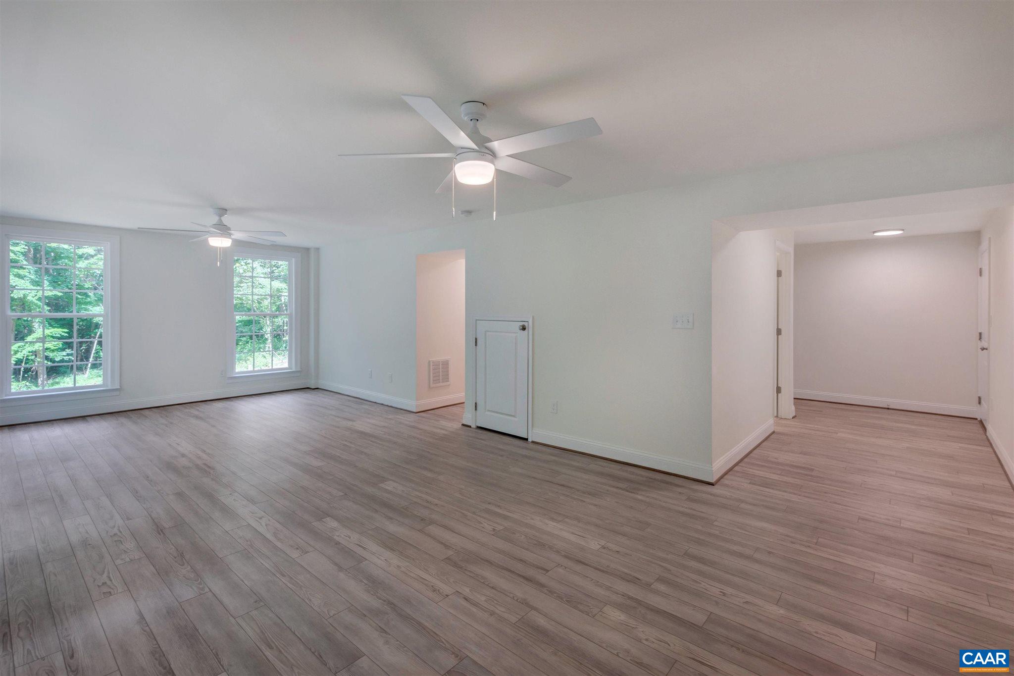 312 Jonquil Road Ruckersville, VA 22968 - Photo 21 of 34 a view of an empty room with window and wooden floor