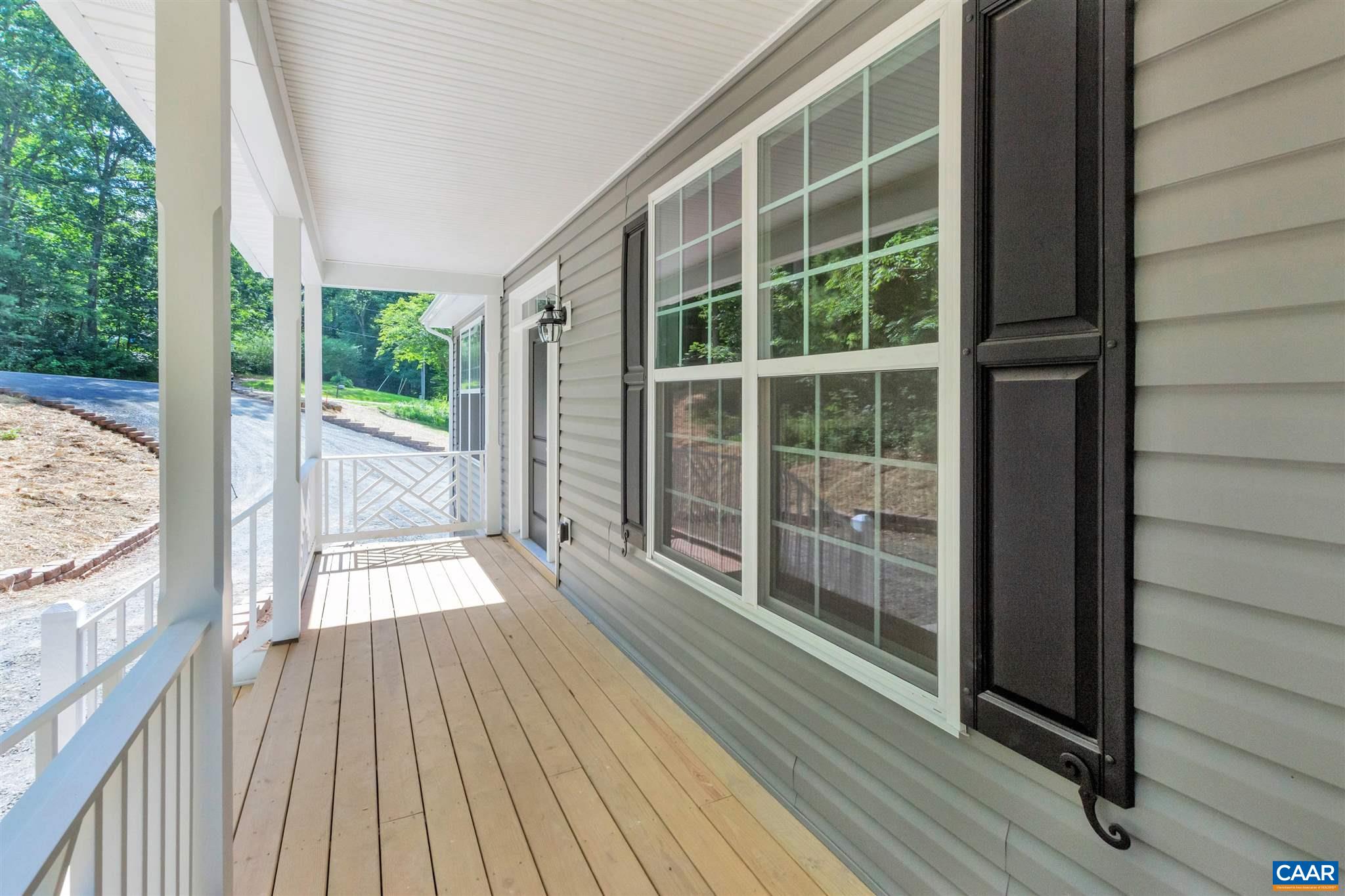 312 Jonquil Road Ruckersville, VA 22968 - Photo 26 of 34 a view of a balcony with wooden floor