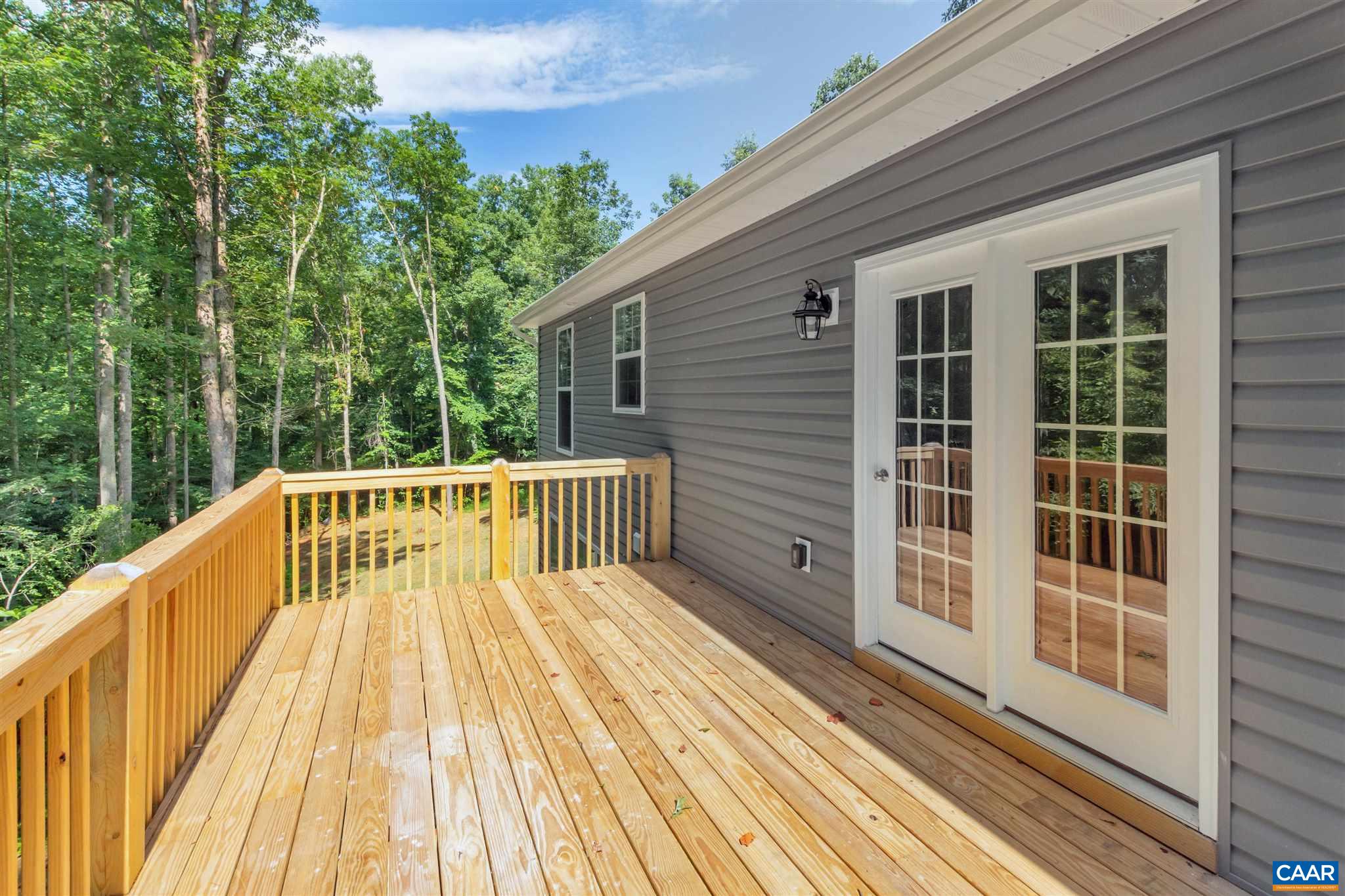 312 Jonquil Road Ruckersville, VA 22968 - Photo 30 of 34 a view of balcony with wooden floor and fence