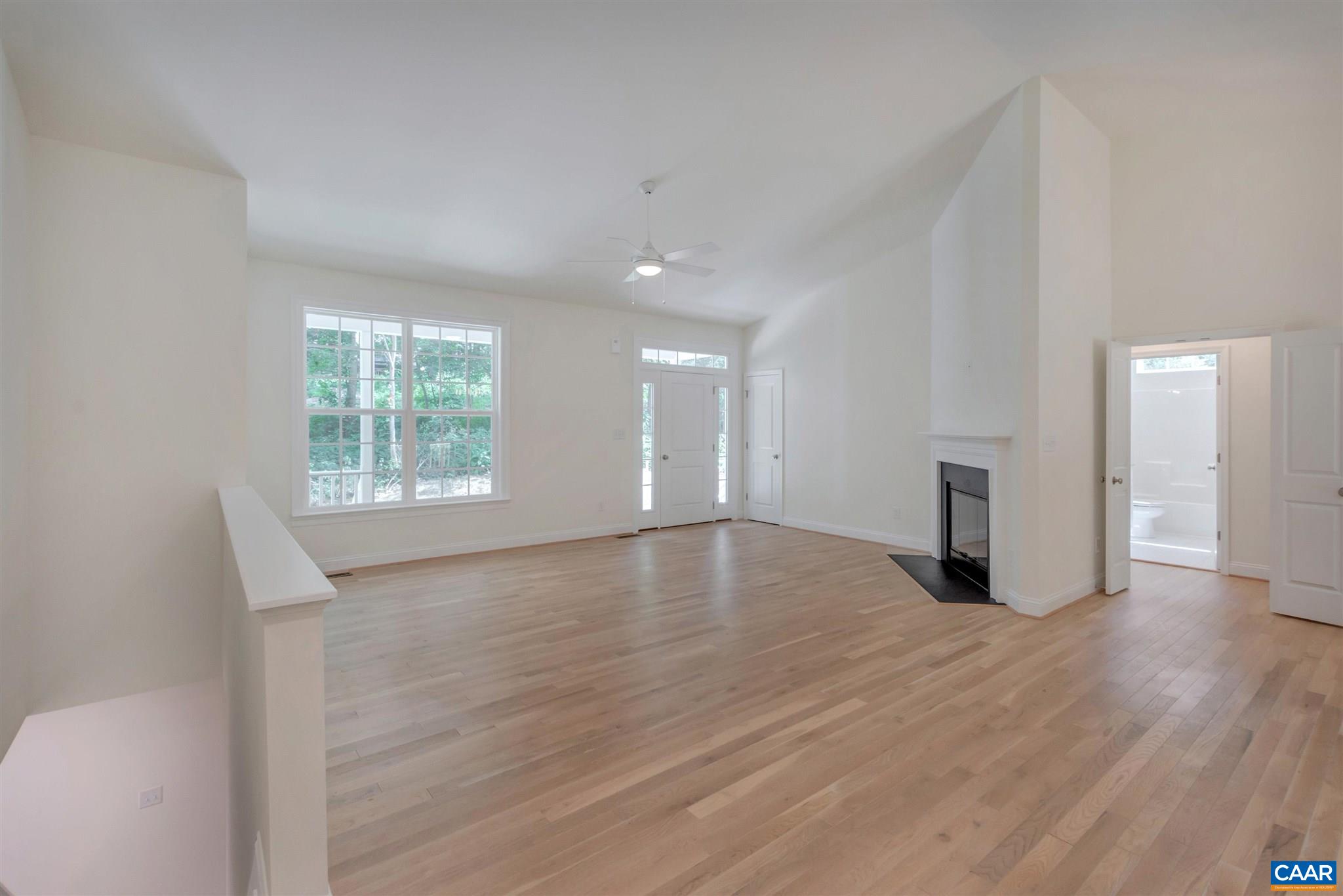 312 Jonquil Road Ruckersville, VA 22968 - Photo 8 of 34 an empty room with wooden floor and a window
