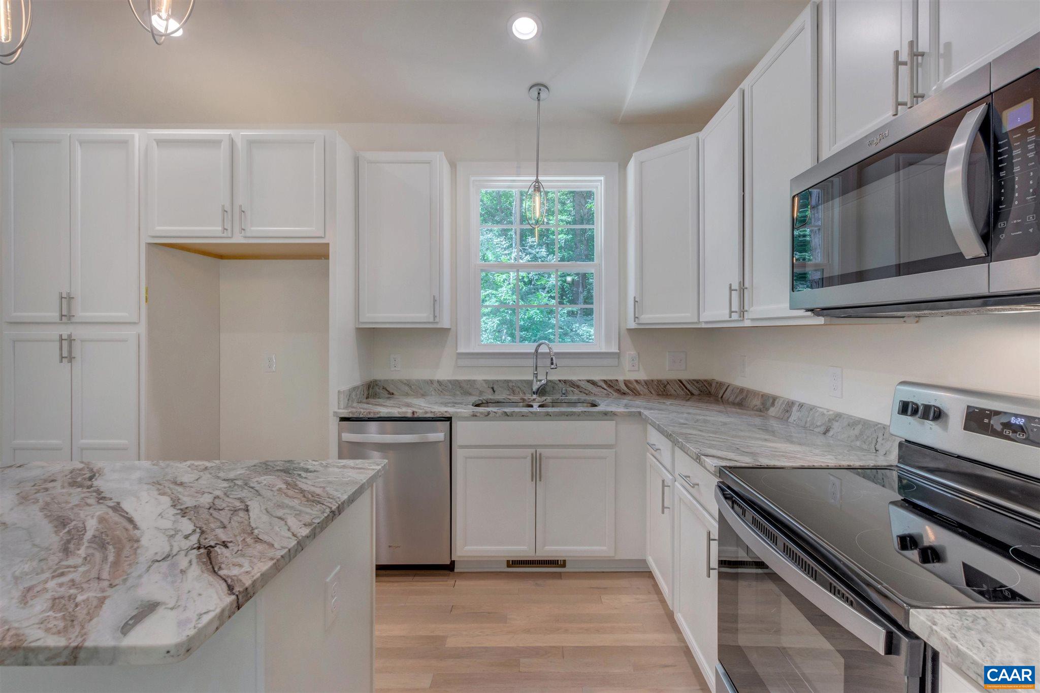 312 Jonquil Road Ruckersville, VA 22968 - Photo 10 of 34 a kitchen with stainless steel appliances granite countertop a stove a sink and a microwave