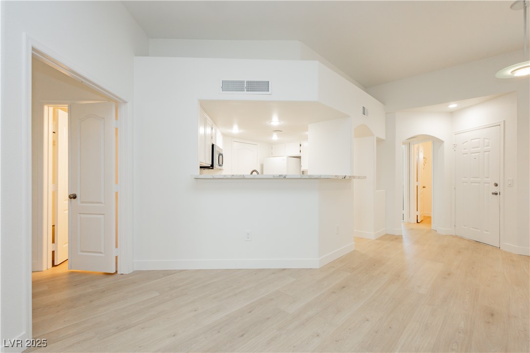 7400 West Flamingo Road, Unit 2033 Las Vegas, NV 89147 - Photo 9 of 38 Freshly painted throughout, 10mm waterproof flooring and 5" modern baseboards.