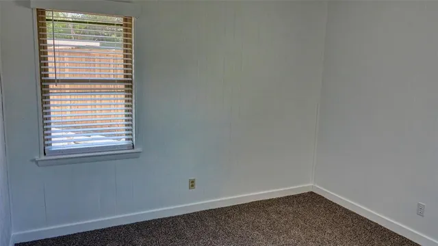 a view of a room that has a window in it