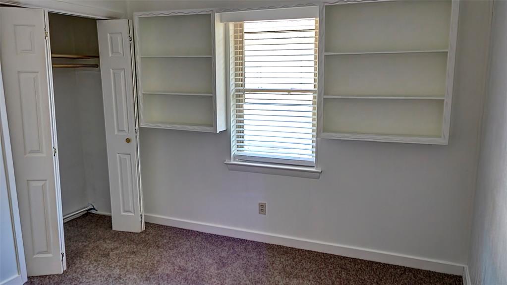 2612 West Rochelle Road Irving, TX 75062 - Photo 13 of 29 Unfurnished bedroom with carpet floors and a closet