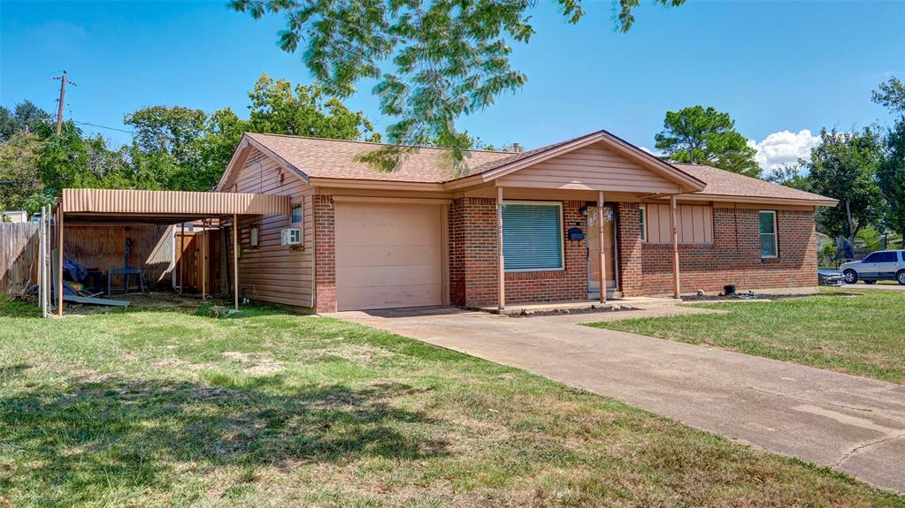 2612 West Rochelle Road Irving, TX 75062 - Photo 2 of 29 Single story corner lotnhome with brick siding, a front yard, Carport