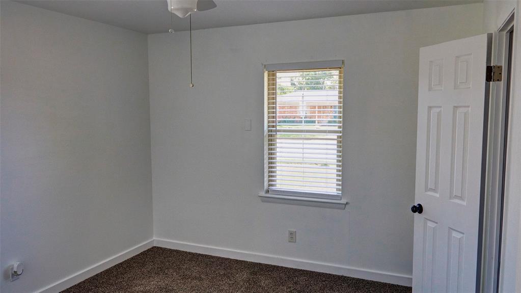 2612 West Rochelle Road Irving, TX 75062 - Photo 8 of 29 Bedroom featuring dark colored carpet and a ceiling fan