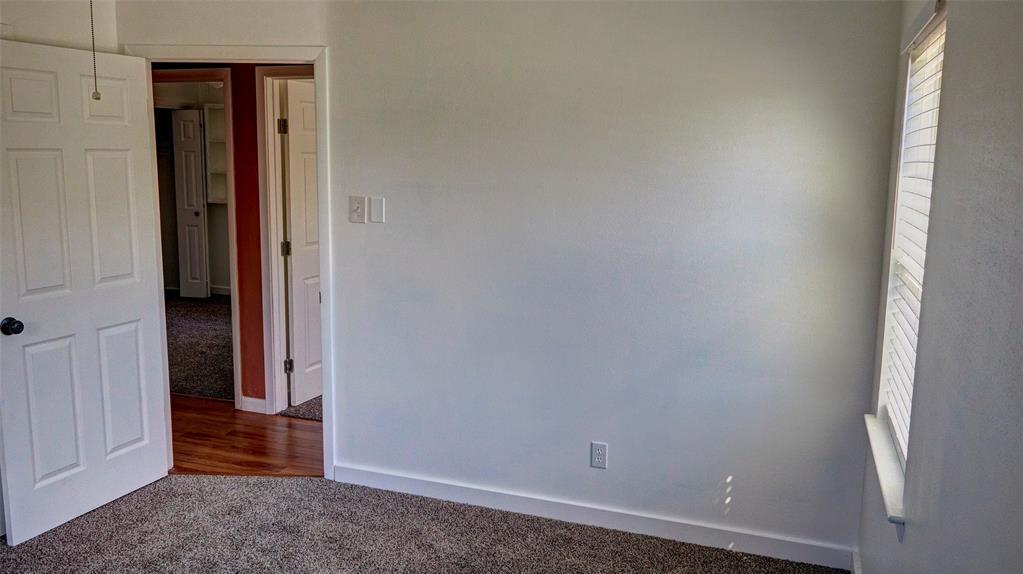 2612 West Rochelle Road Irving, TX 75062 - Photo 9 of 29 Bedroom with carpet and baseboards