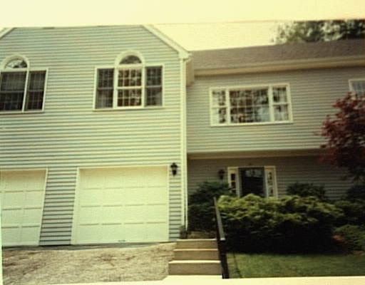 120-26 Prospect Street Ridgefield, CT 06877 - Photo 1 of 1 a front view of a house with a garden
