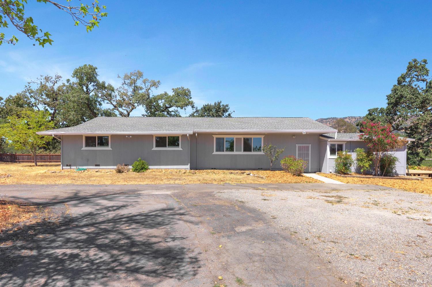 1120 Soda Canyon Road Napa, CA 94558 - Photo 2 of 38 a view of a house with a yard and a large tree