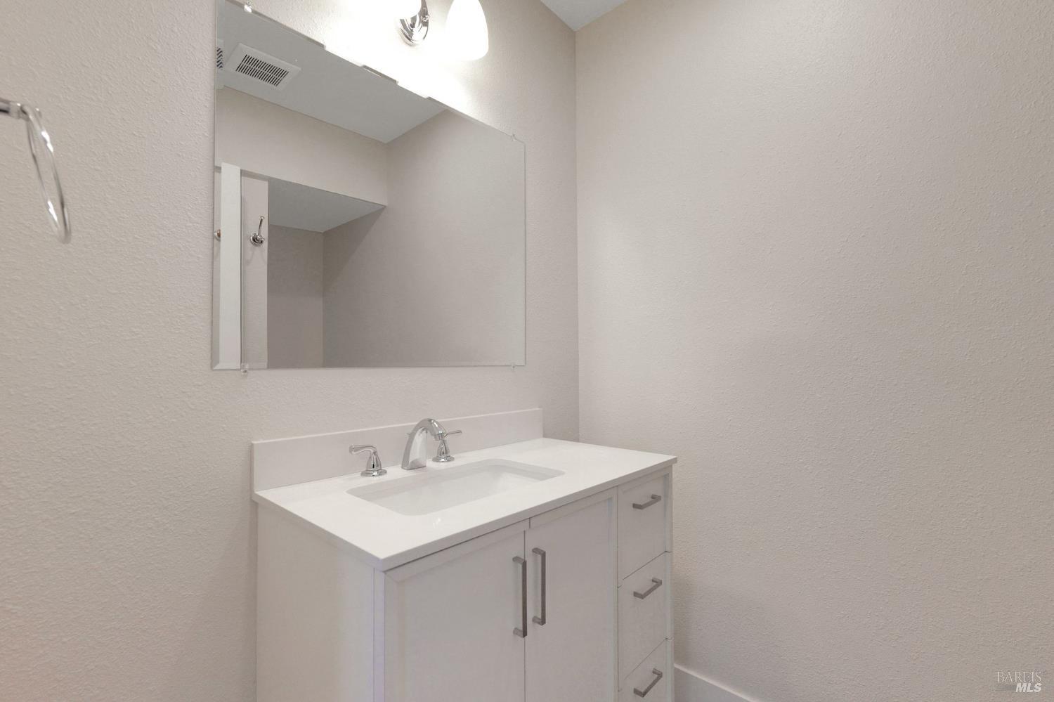 1120 Soda Canyon Road Napa, CA 94558 - Photo 27 of 38 a bathroom with a sink and a mirror