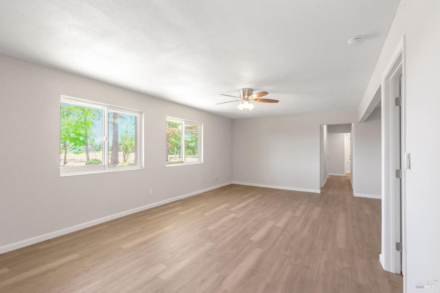 1120 Soda Canyon Road Napa, CA 94558 - Photo 30 of 38 an empty room with wooden floor and windows