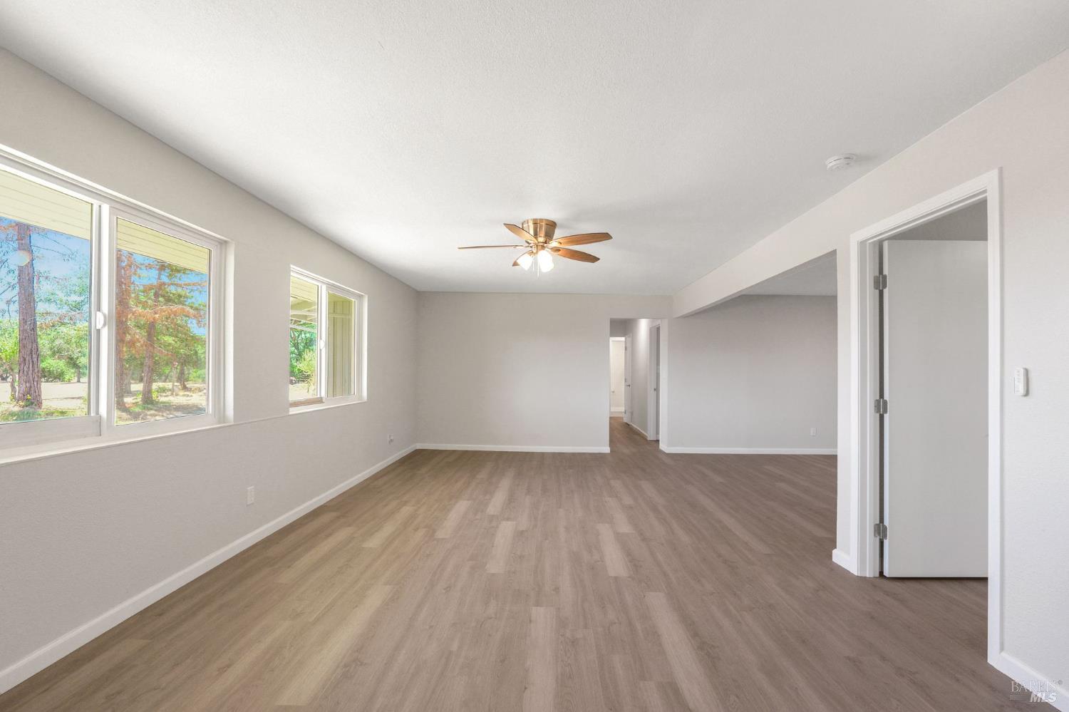 1120 Soda Canyon Road Napa, CA 94558 - Photo 32 of 38 a view of an empty room with wooden floor and a window