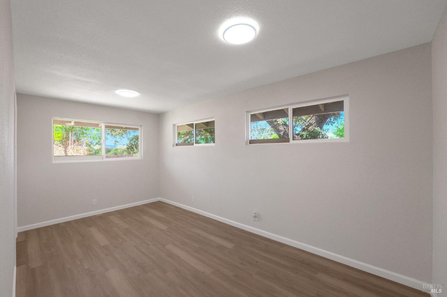 1120 Soda Canyon Road Napa, CA 94558 - Photo 7 of 38 an empty room with windows