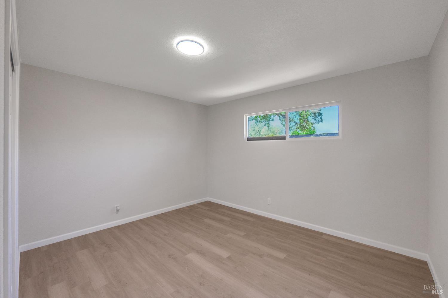 1120 Soda Canyon Road Napa, CA 94558 - Photo 8 of 38 an empty room with windows