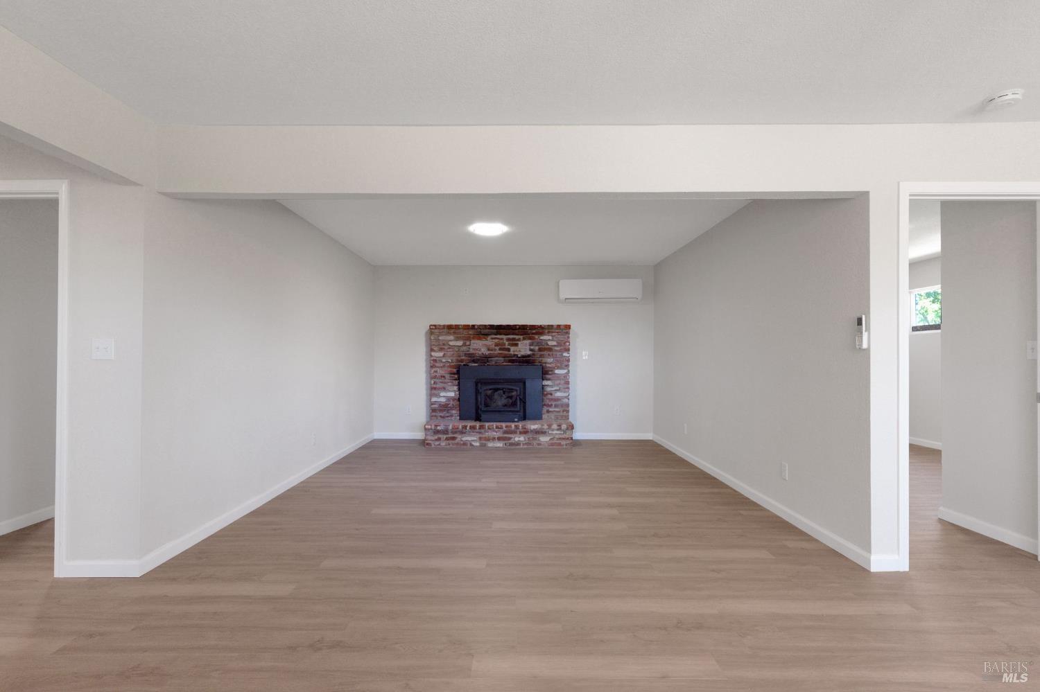 1120 Soda Canyon Road Napa, CA 94558 - Photo 10 of 38 a view of an empty room with a fireplace
