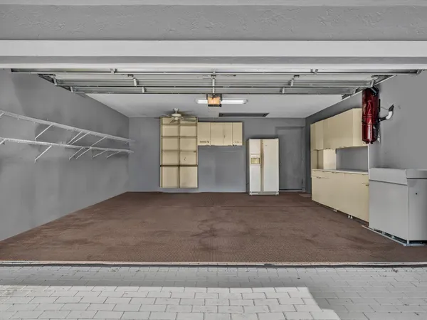 an aerial view of residential houses with outdoor space and swimming pool