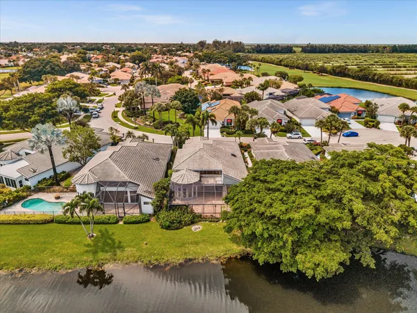 a dining room with lots of tables a large window and chairs