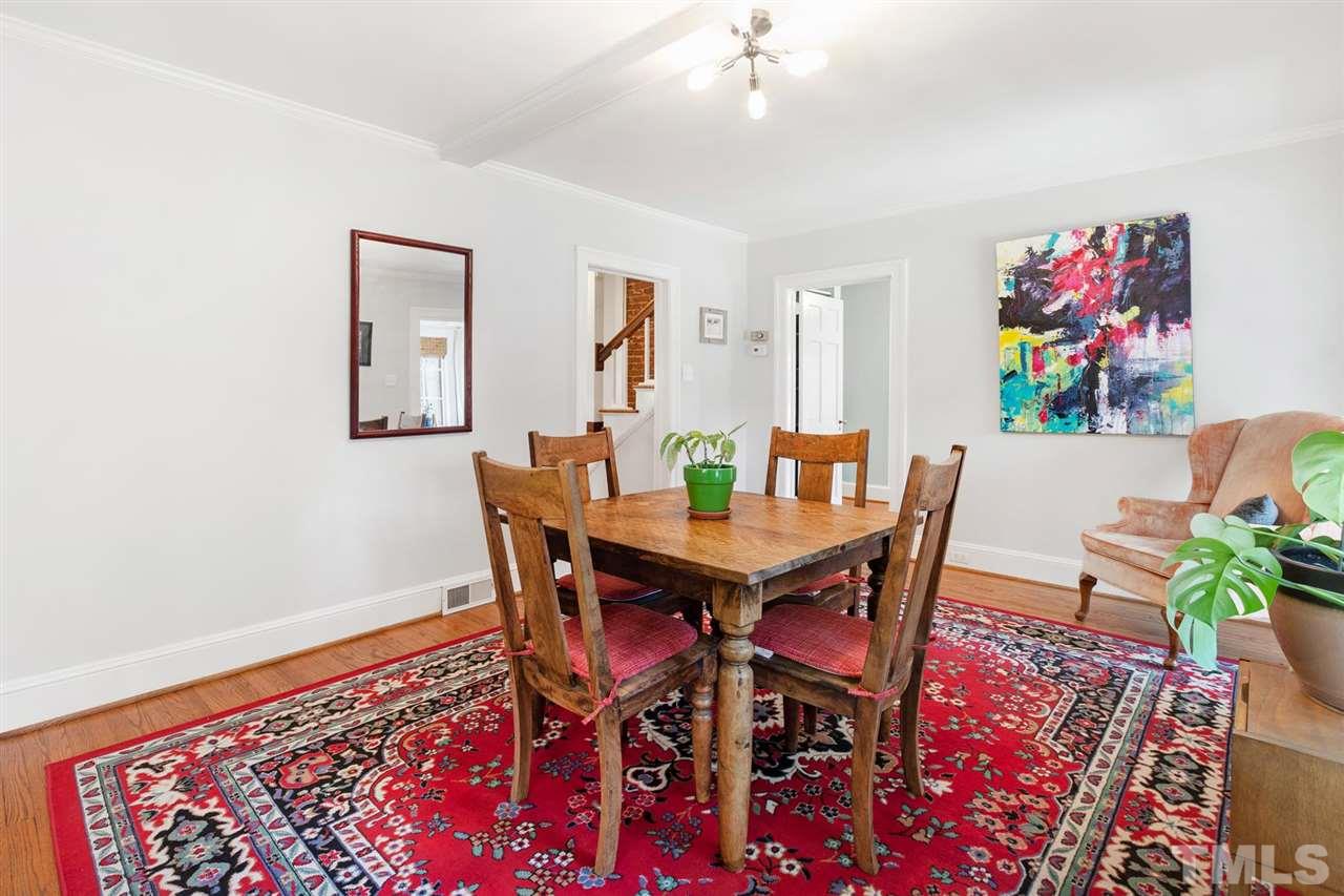902 Lake Boone Trail Raleigh, NC 27607 - Photo 17 of 30 a view of a dining room with furniture and wooden floor