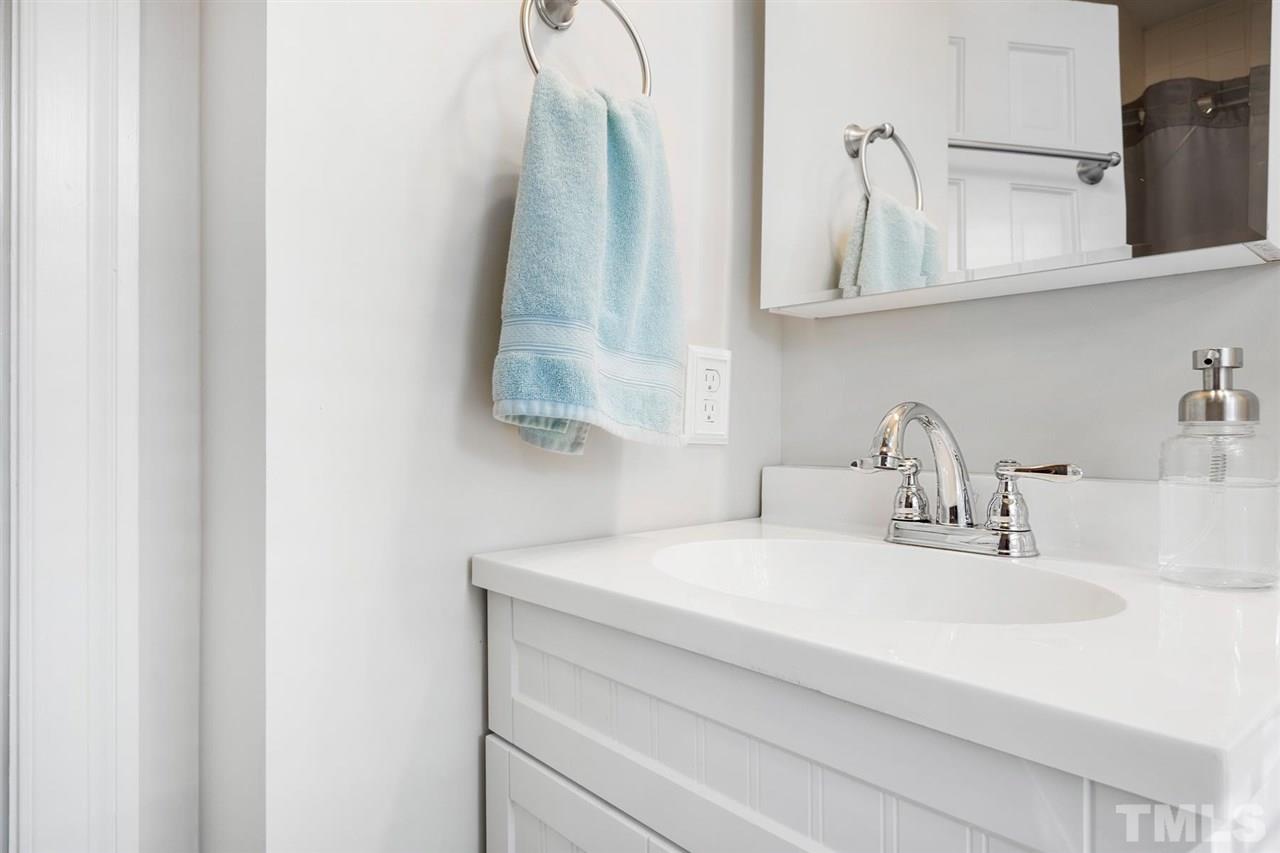 902 Lake Boone Trail Raleigh, NC 27607 - Photo 22 of 30 a bathroom with a sink and a mirror