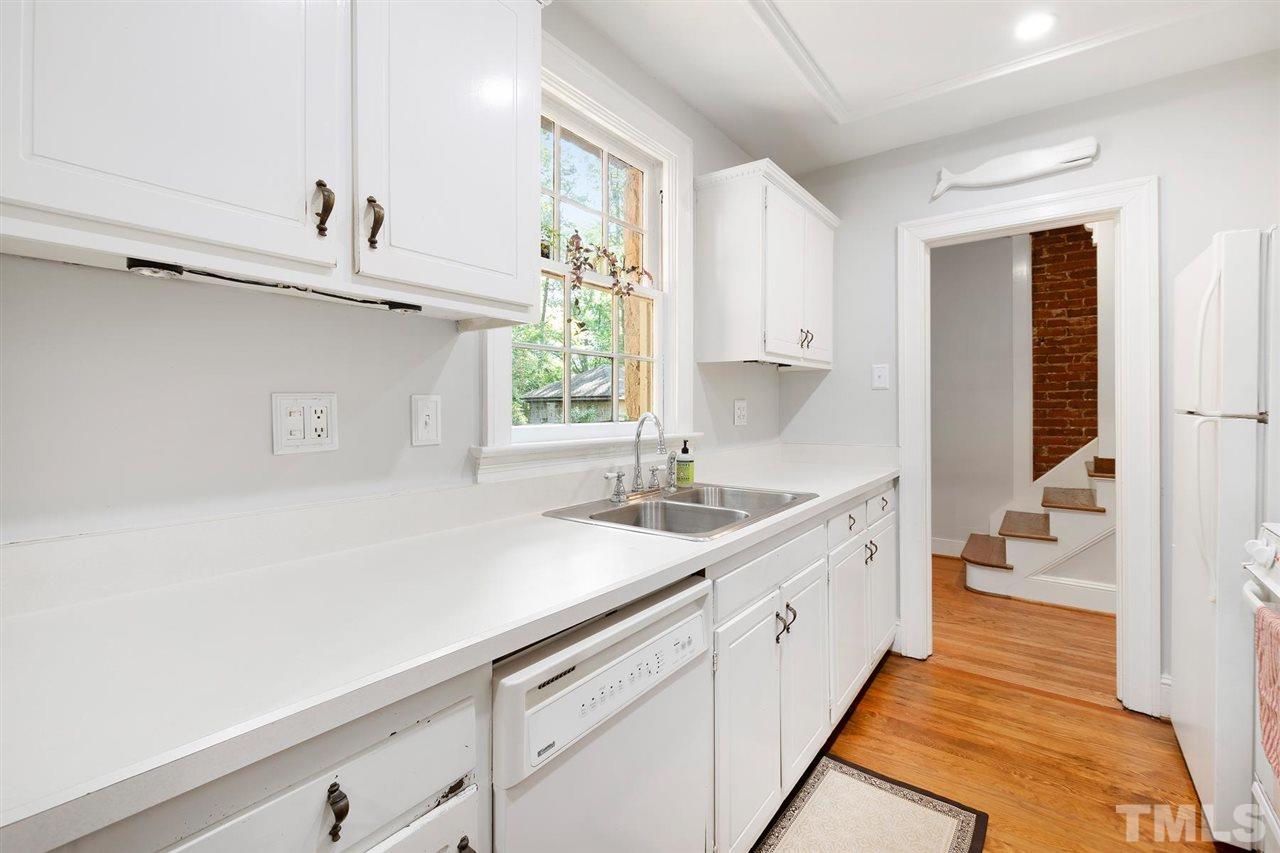 902 Lake Boone Trail Raleigh, NC 27607 - Photo 24 of 30 a kitchen with a sink and a window