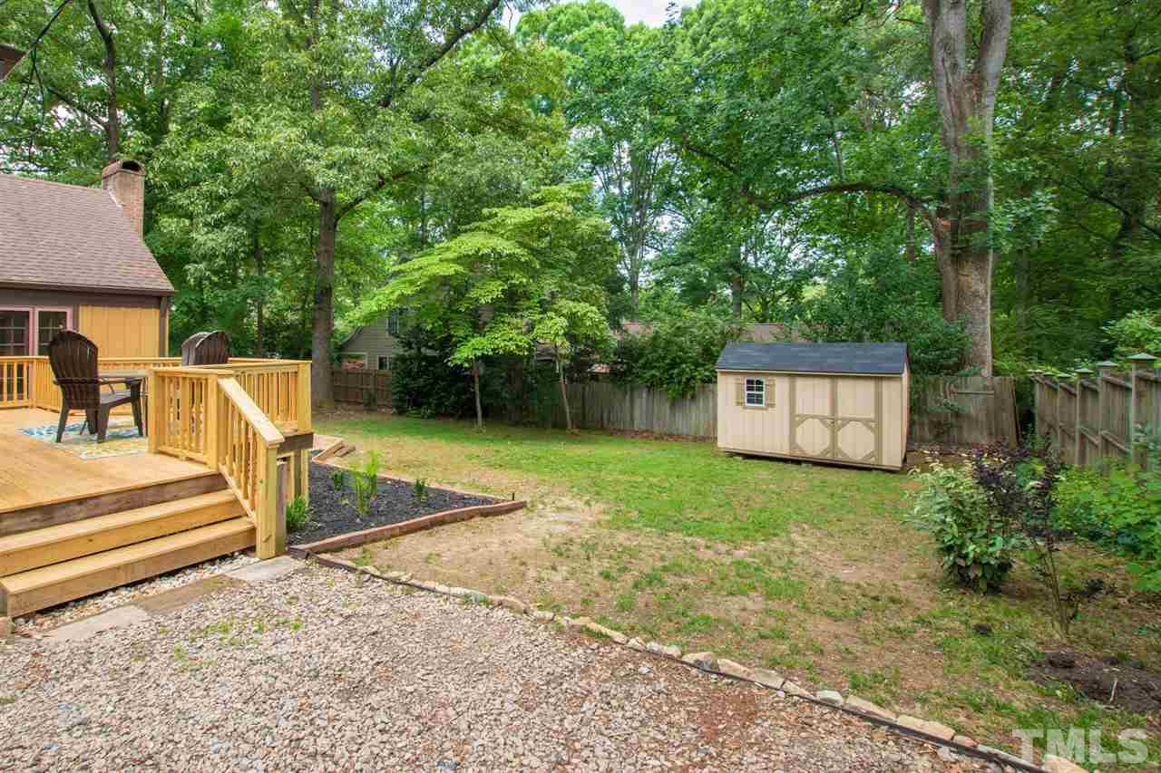 902 Lake Boone Trail Raleigh, NC 27607 - Photo 5 of 30 a view of a house with backyard and a tree