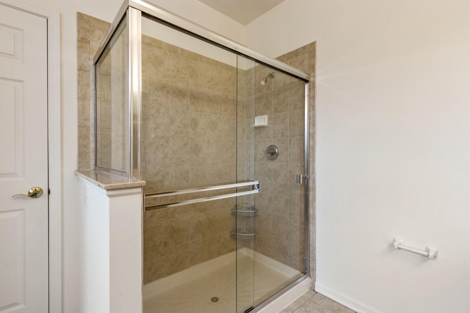 1391 Scarboro Road, Unit 201 Schaumburg, IL 60193 - Photo 12 of 20 a bathroom with a glass shower door