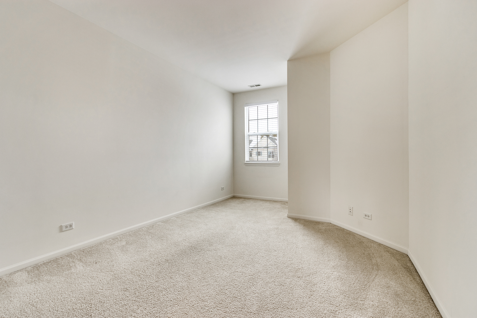 1391 Scarboro Road, Unit 201 Schaumburg, IL 60193 - Photo 14 of 20 an empty room with windows and closet