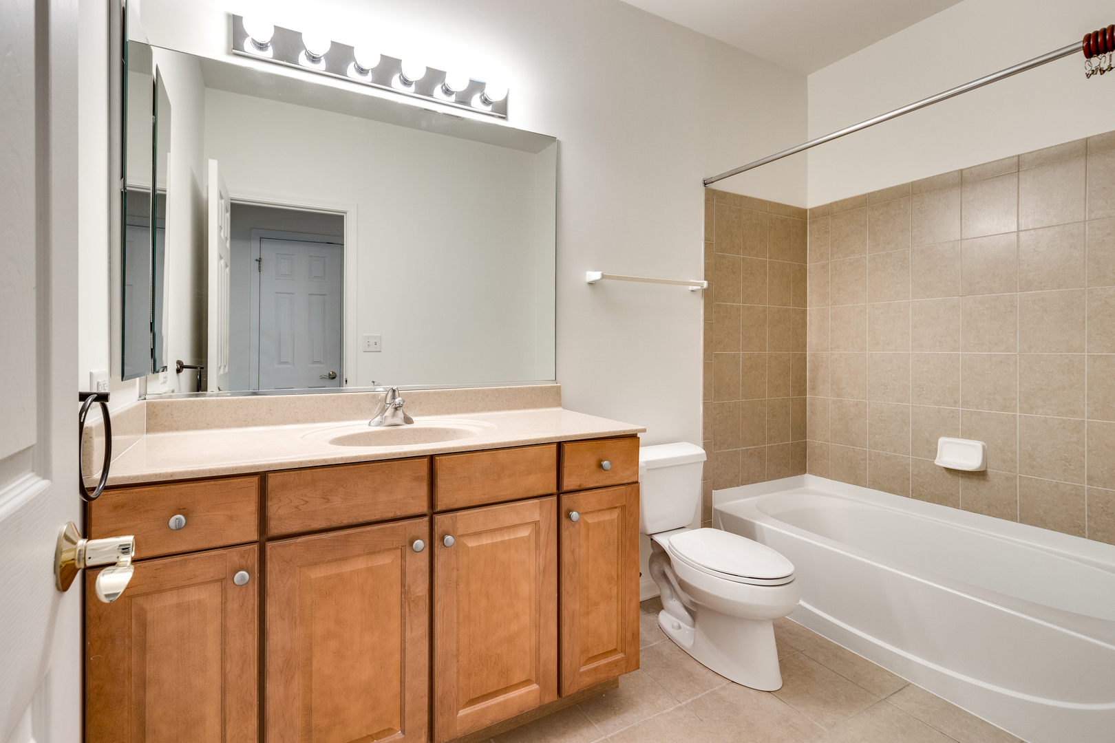1391 Scarboro Road, Unit 201 Schaumburg, IL 60193 - Photo 15 of 20 a bathroom with a sink a toilet and shower