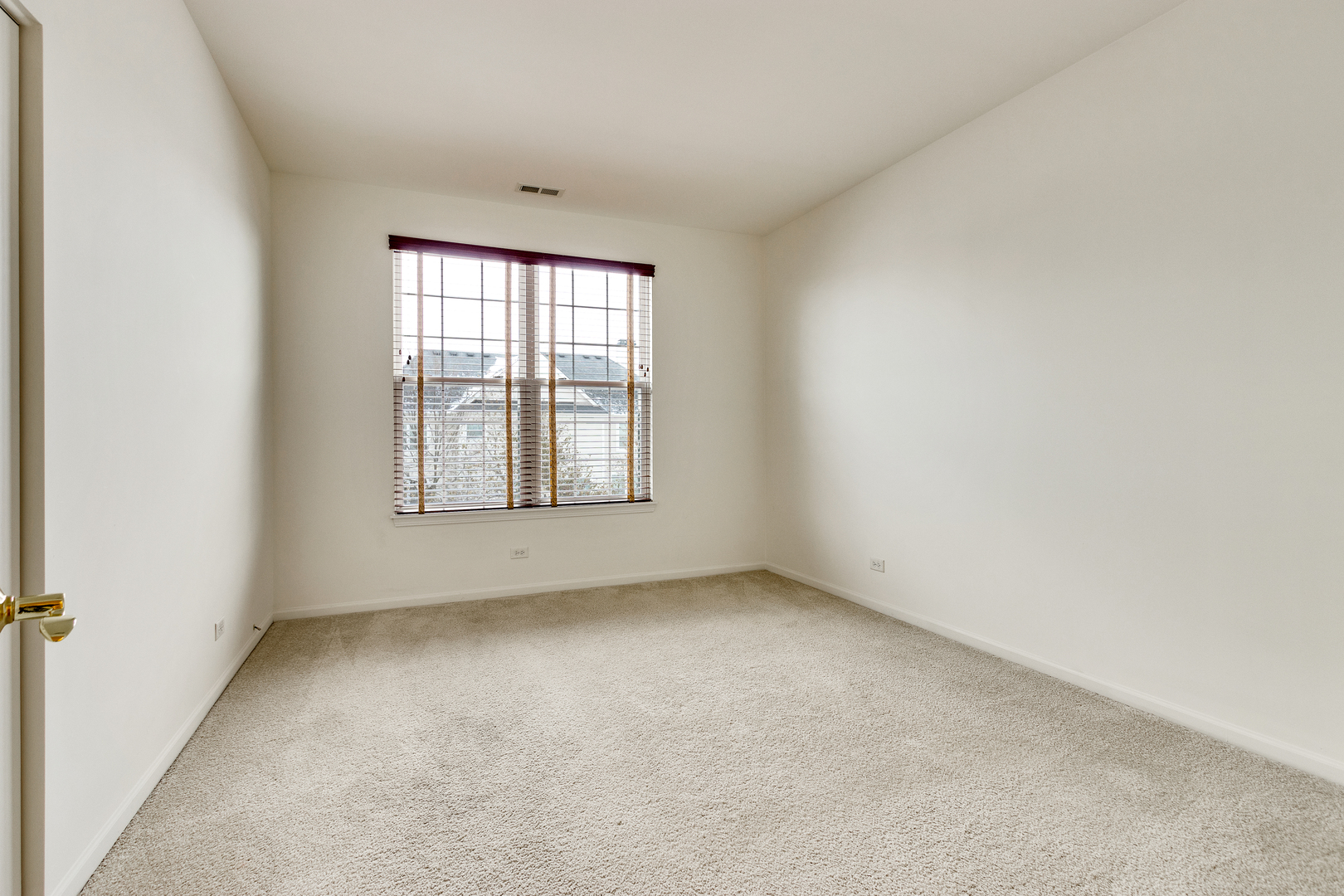 1391 Scarboro Road, Unit 201 Schaumburg, IL 60193 - Photo 16 of 20 an empty room with a window