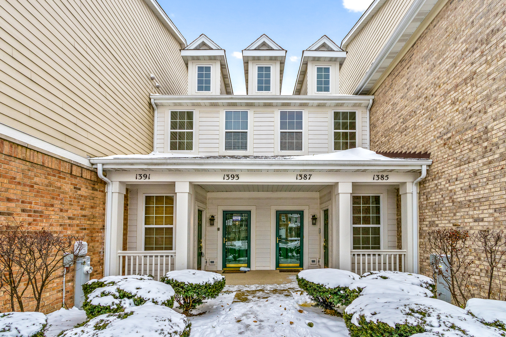 1391 Scarboro Road, Unit 201 Schaumburg, IL 60193 - Photo 2 of 20 front view of a brick house with a large windows