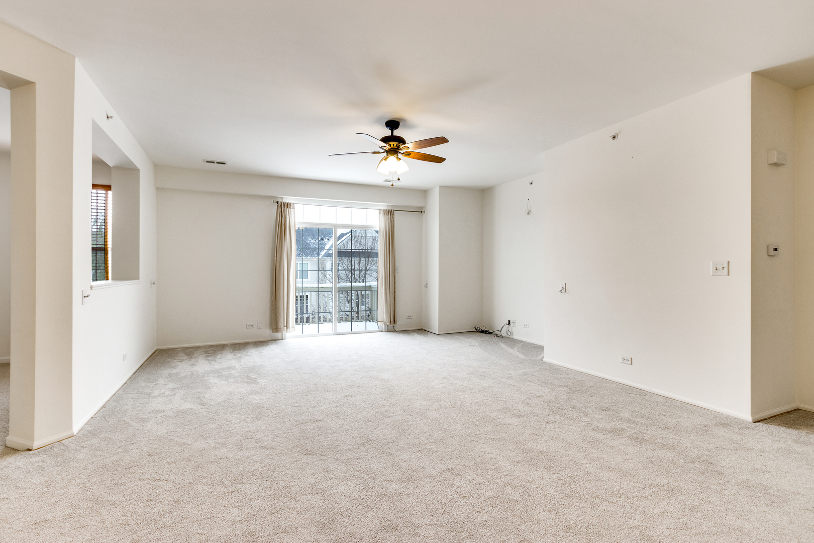 1391 Scarboro Road, Unit 201 Schaumburg, IL 60193 - Photo 5 of 20 a view of an empty room with a window