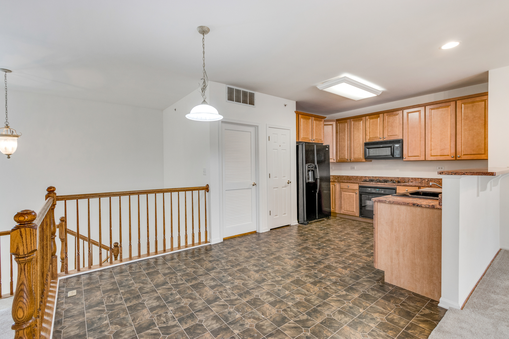 1391 Scarboro Road, Unit 201 Schaumburg, IL 60193 - Photo 8 of 20 a kitchen with stainless steel appliances granite countertop a refrigerator a stove top oven a sink and dishwasher