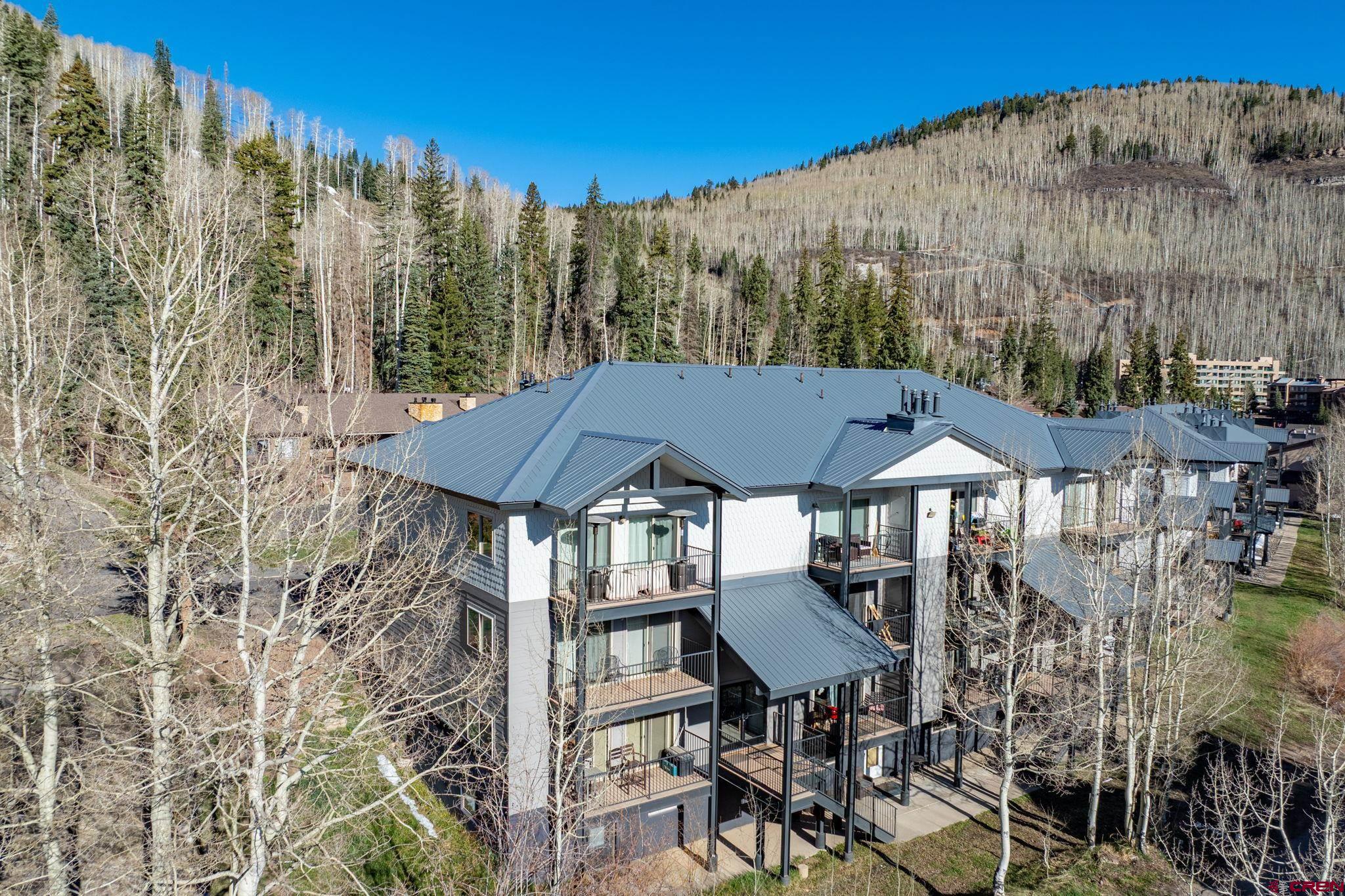 395 Sheol Street, Unit 117 Durango, CO 81301 - Photo 28 of 28 a patio with table and chairs with wooden floor